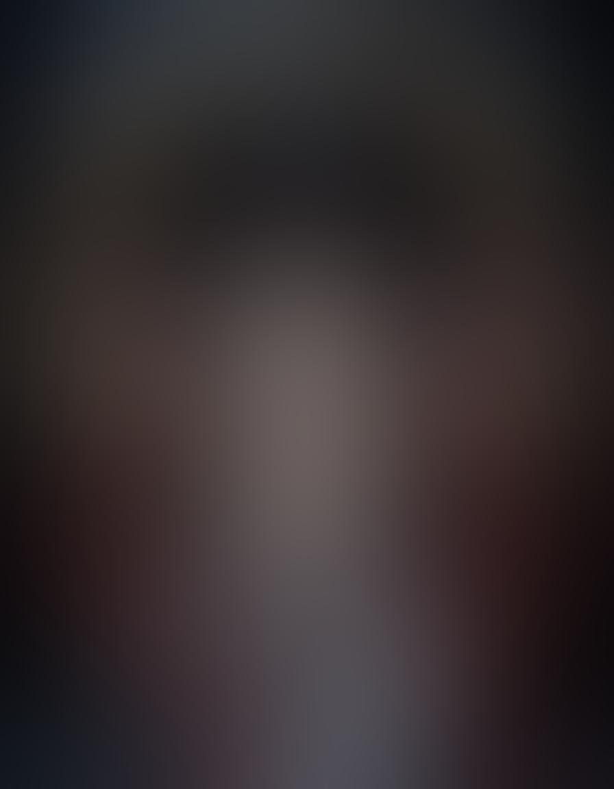 An enigmatic figure delicately removing a mask that represents various iconic hentai and adult anime characters, depicting vivid mythological elements swirling around. The backdrop should feature a blend of bright colors that contrasts with darker shadows, symbolizing the clash of truth and myth. Include ethereal motifs like broken chains or hidden doors, suggesting revelation and discovery. The style should be surreal and vibrant, with intricate details that draw the viewer in. super-realistic. vibrant colors. dark background.